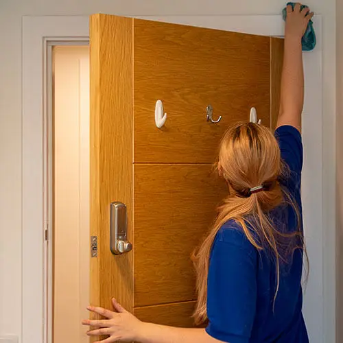 deep cleaning example - cleaner wiping down the ledges around door frames - deep cleaning in Norwich and Norfolk